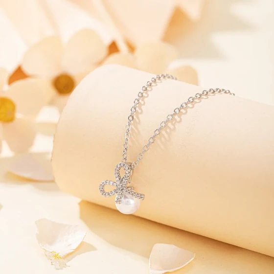 French-style light luxury bow necklace for women, European and American niche, simple and elegant, with faux pearl pendant