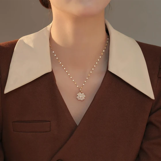 Meichen's new trendy rotating four-leaf clover titanium steel necklace for women, with a cool and sophisticated feel, featuring a copper pendant