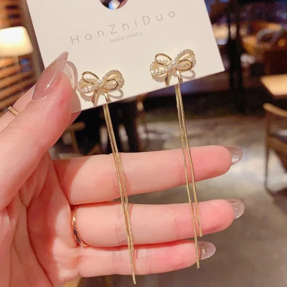 Korean zircon bow earrings for women, simple long style, dual-wear tassel earrings, versatile and stylish ear accessories
