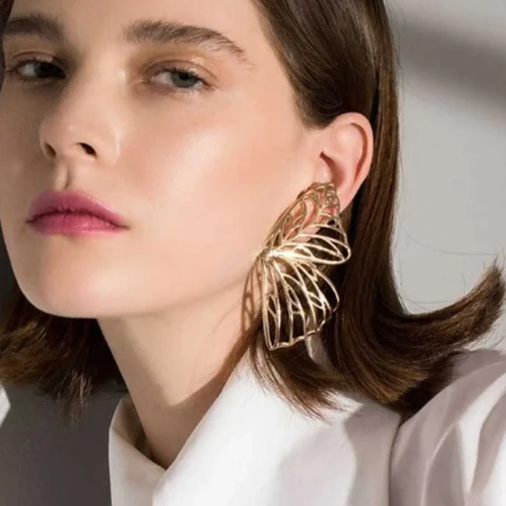 Simple and unique short hollow butterfly wing design creative Korean style earrings for women