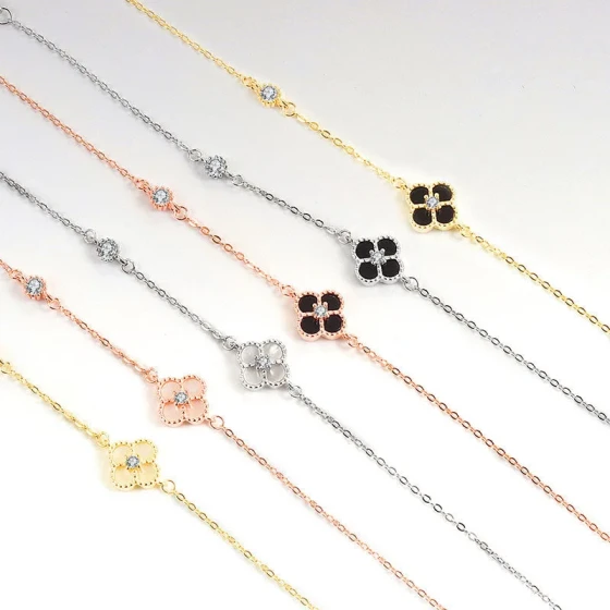 Korean and Japanese fashion light luxury black agate jewelry, white mother-of-pearl lucky four-leaf clover zircon bracelet for women live stream