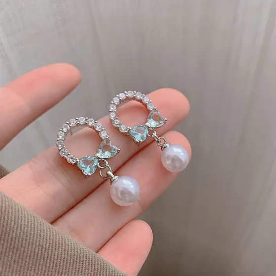 Exquisite and compact zircon bow earrings for women, unique design with a sense of elegance, pearl drop earrings, versatile Korean ear accessories