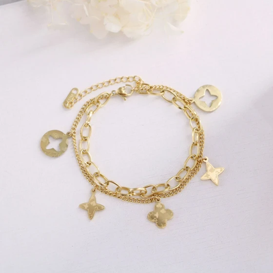 Unique gold Hollow Four-Leaf Clover Tassel Bracelet for Women, Non-Fading, Japanese and Korean Fashion, Prismatic Small Flower Hand Accessory