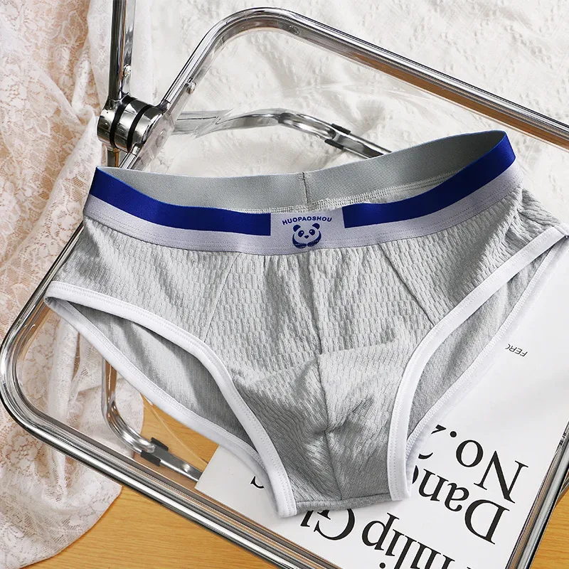 Nuevas bragas para hombres, ropa interior Sexy para niños, bragas de algodón para adolescentes, pantalones triangulares de talla grande, pantalones cortos finos transpirables simples