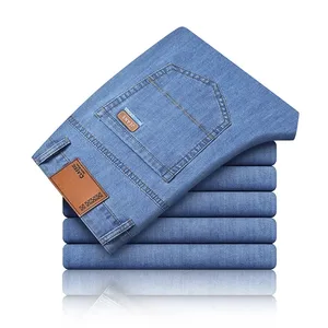 Nova seda gelo fino denim jeans para homens azul em linha reta estiramento calças de algodão negócios casual leve primavera verão